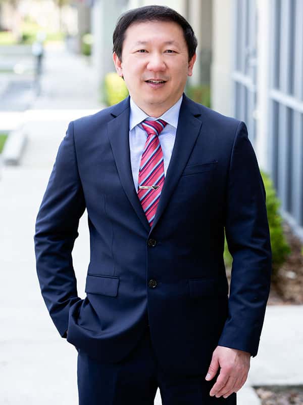 Dr. Peter S. Chen in suit 