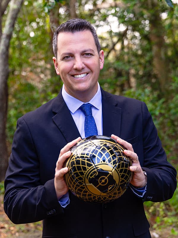 Dr. Luis Alcalde with ball